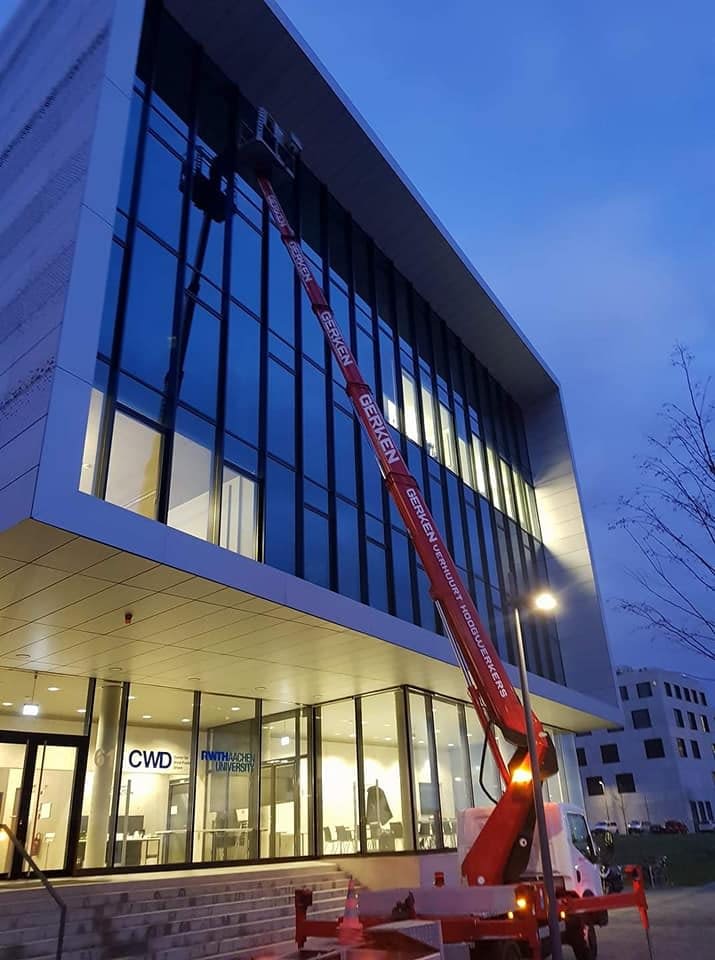 Truck Mounted Boom Lift for Cleaning Windows - Downtown Denver CO